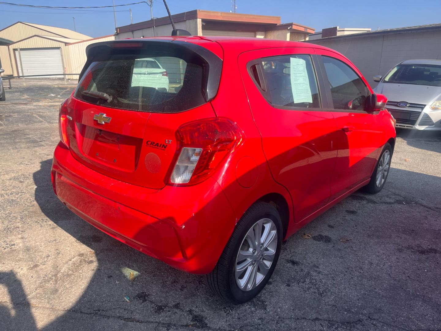 2017 RED CHEVROLET SPARK 1LT 1LT CVT (KL8CD6SA9HC) with an 1.4L L4 16V DOHC engine, CVT transmission, located at 8101 E. Skelly Dr., Tulsa, OK, 74129, (918) 592-3593, 36.121891, -95.888802 - Photo#3